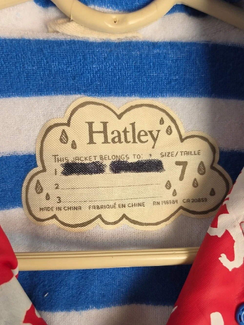 Hatley Red Raincoat with White Dinosaur Print Changes Color When Wet